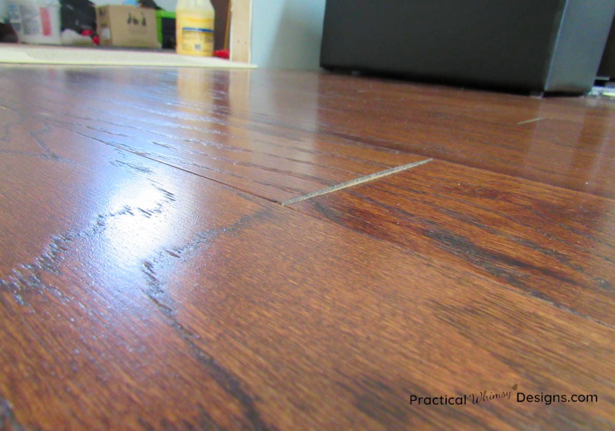 Engineered hardwood floor board warping at the edge