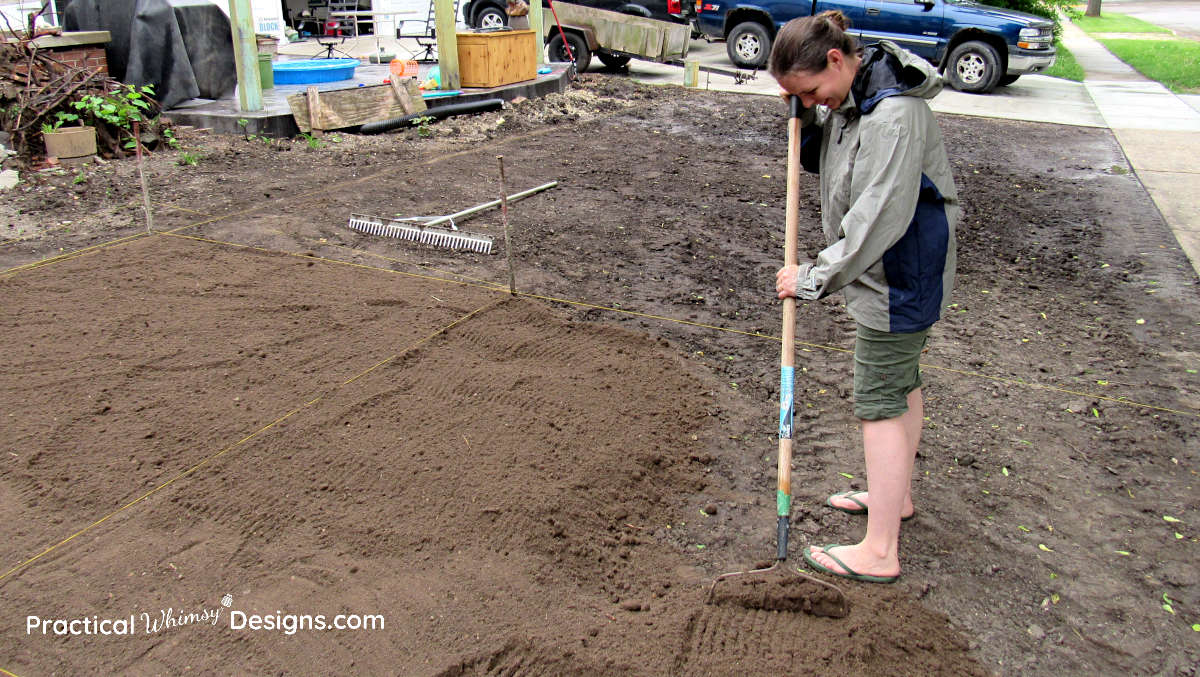 Raking dirt for grass seed planting