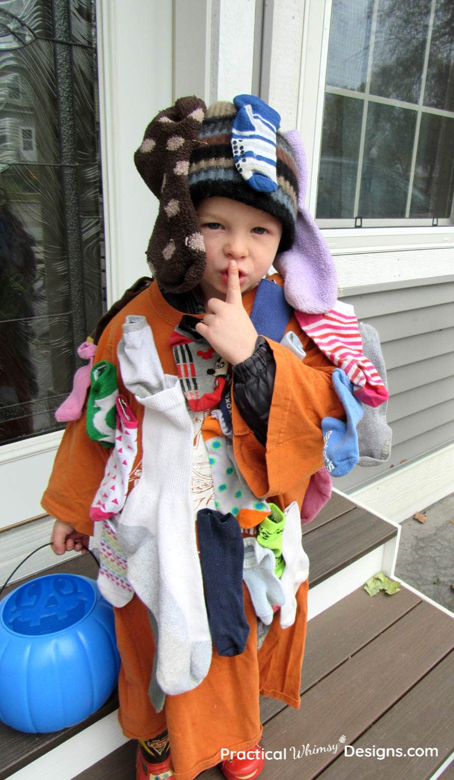 Little boy wearing sock monster costume
