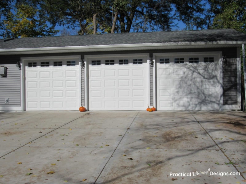 Grey and white garage with pumpkins
