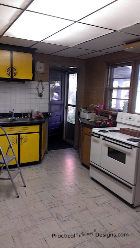 Kitchen with lemon yellow cabinets and stove