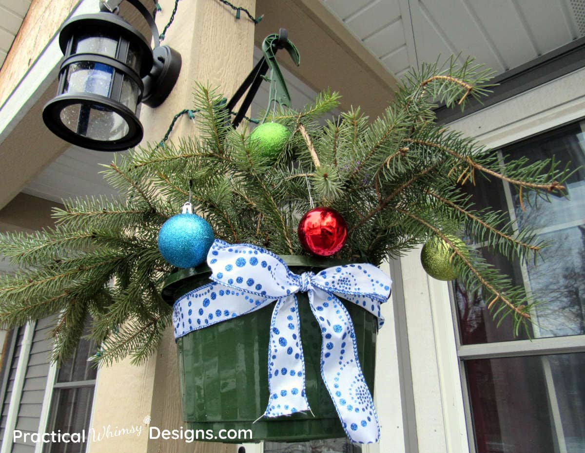 Hanging basket with Christmas ornaments and ribbon