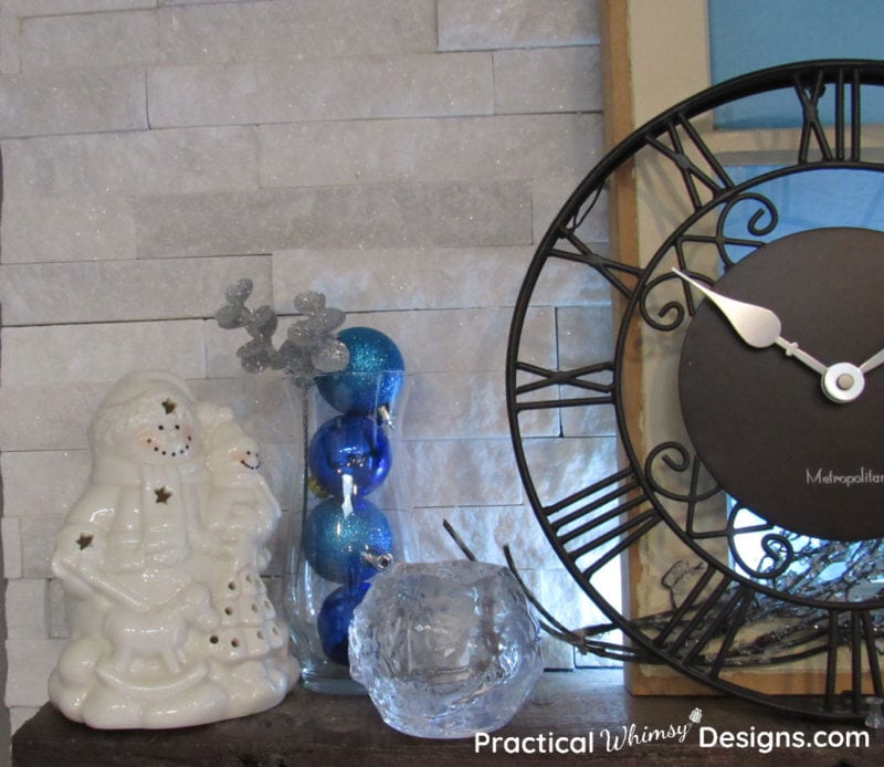 Blue ornaments in vase with snowman