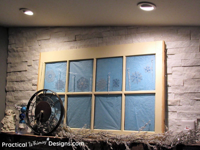 Snowflake window decals on mantel window