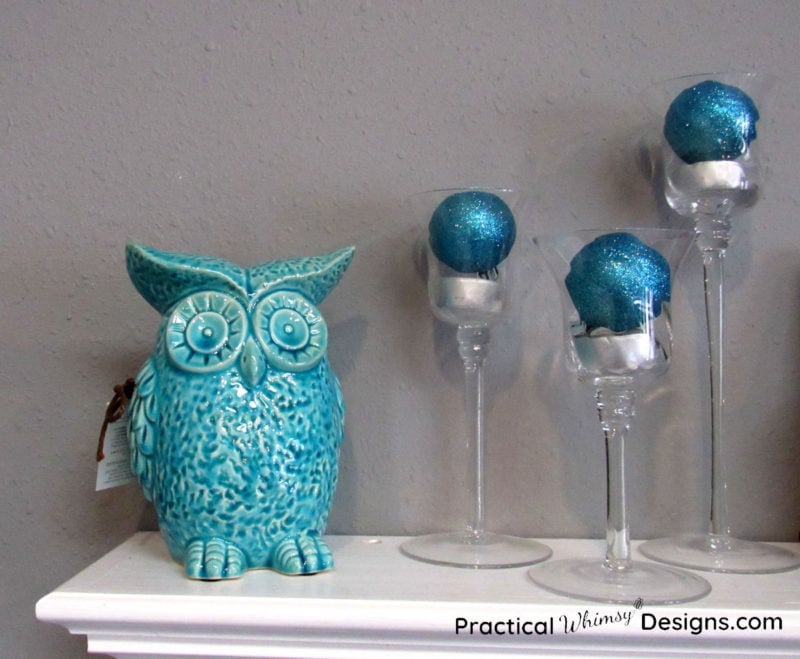 Teal owl figurine with blue candlesticks