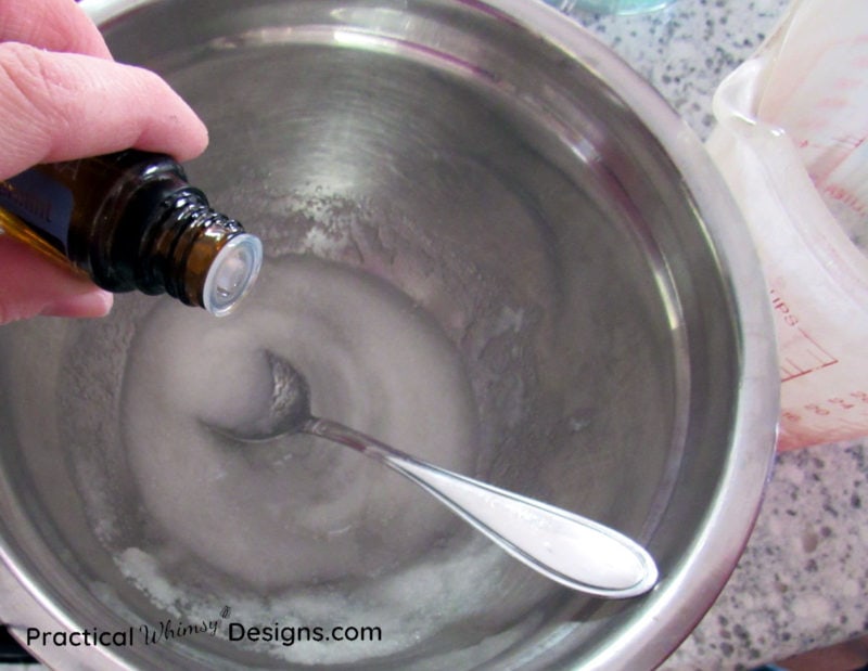 Adding peppermint essential oil to sugar scrub