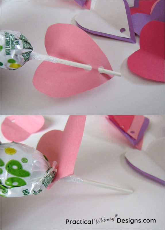 Adding paper hearts onto sucker stick