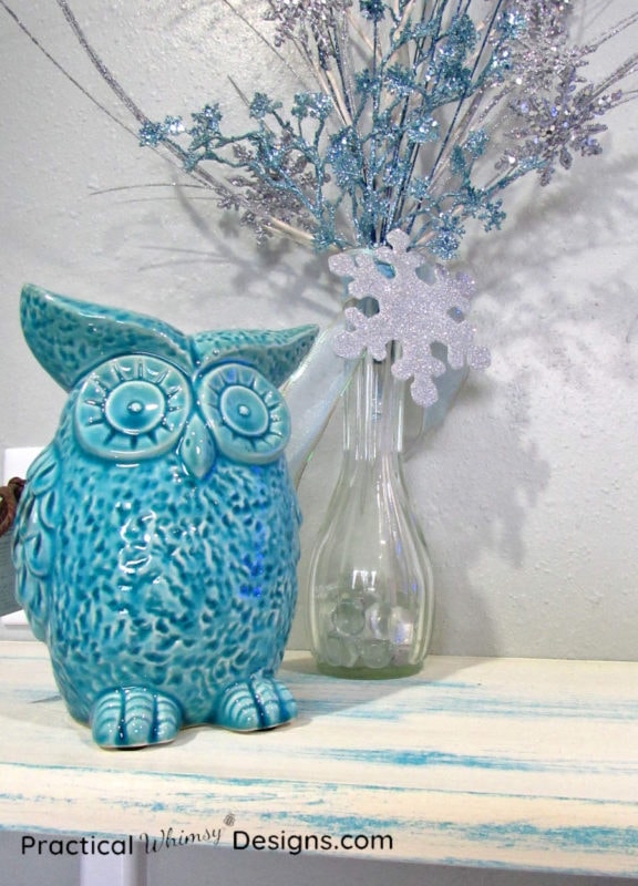 Owl and vase on distressed painted shelf