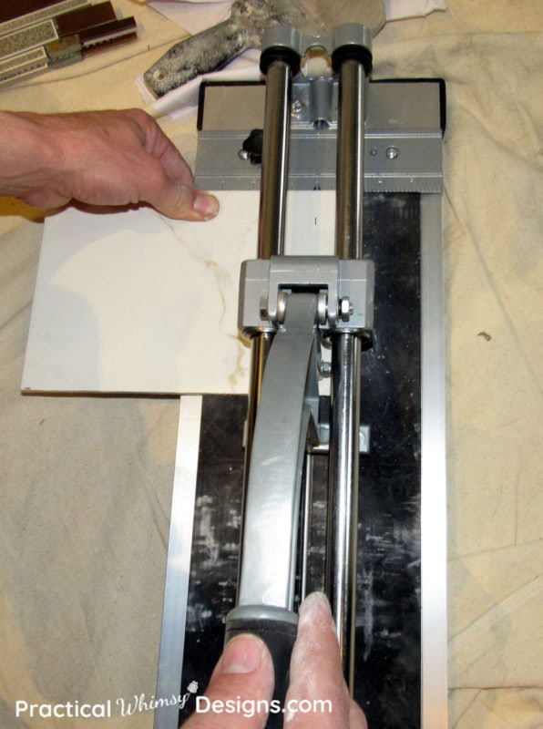 Cutting tile with a tile cutter
