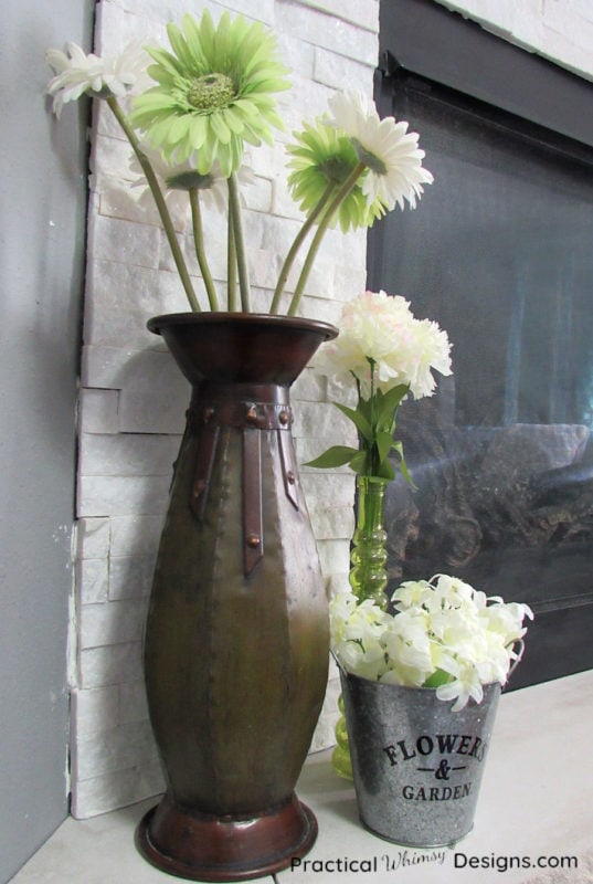 Green and white flowers on hearth