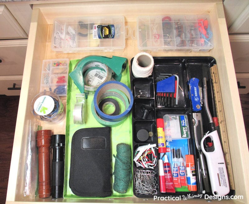 Junk drawer organized with containers