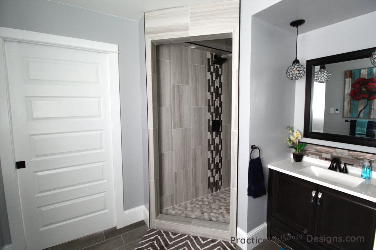 Shower, door and sink in master bathroom