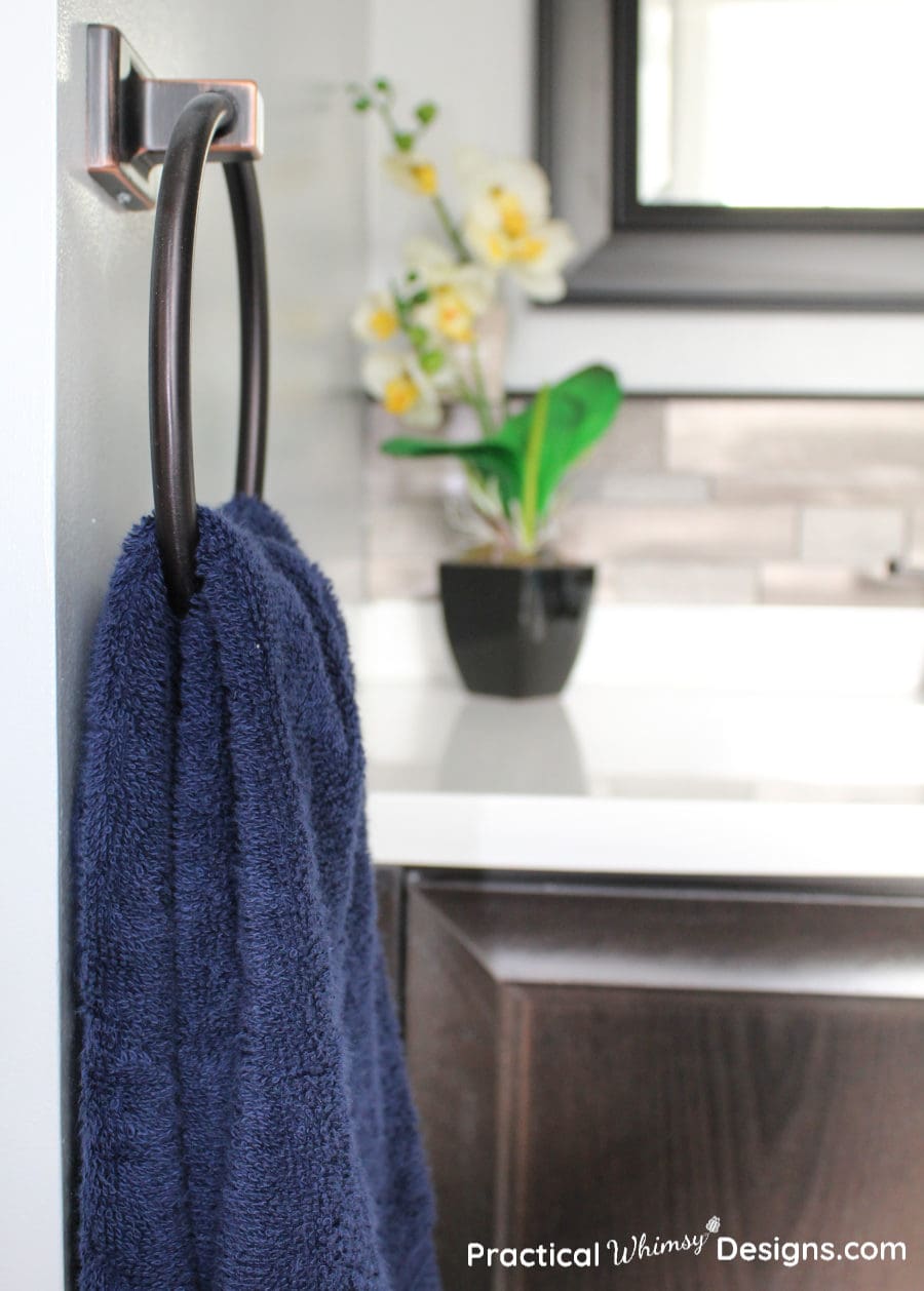 Navy blue hand towel and flower