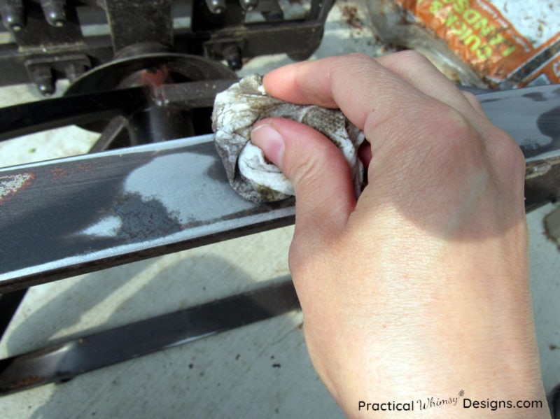 Wiping off the patio furniture