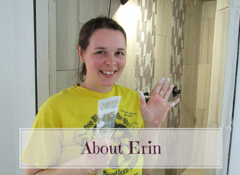 Girl in yellow shirt with paint on hands