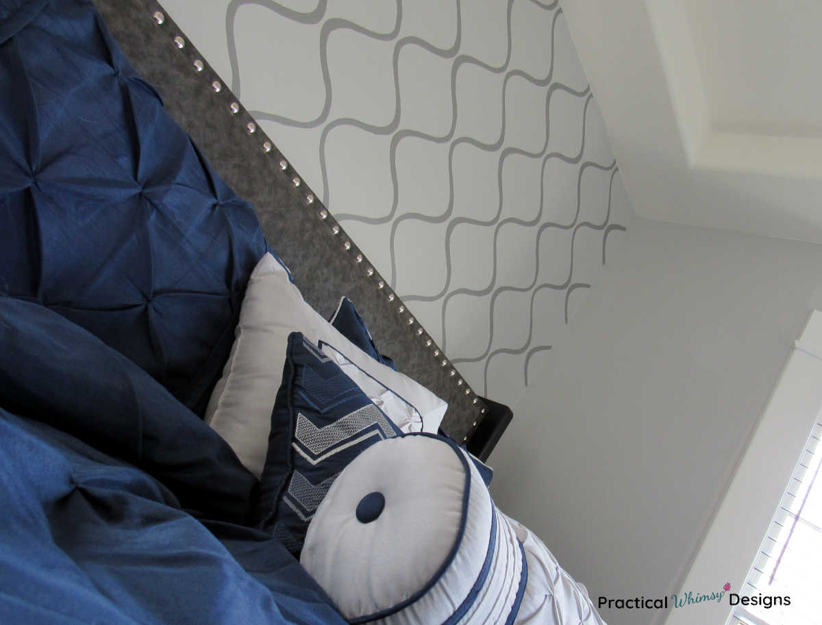 DIY Fabric headboard with blue comforter and pillows