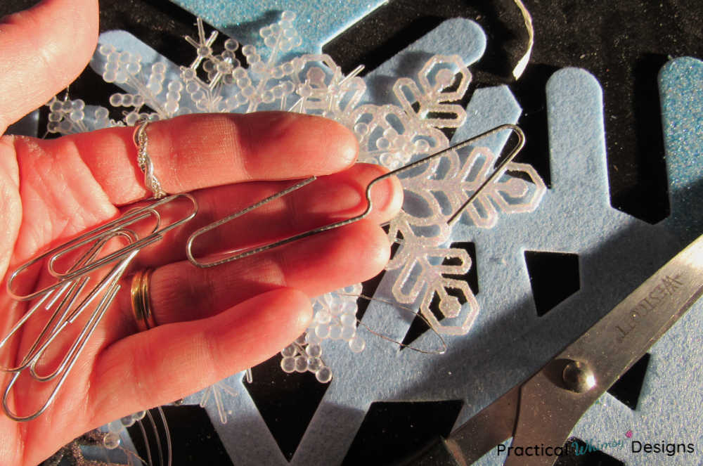 Paperclip bent into a double sided hook.