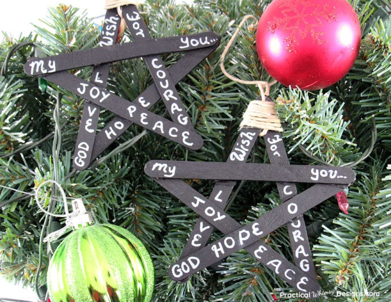 Blackboard star ornaments on tree.