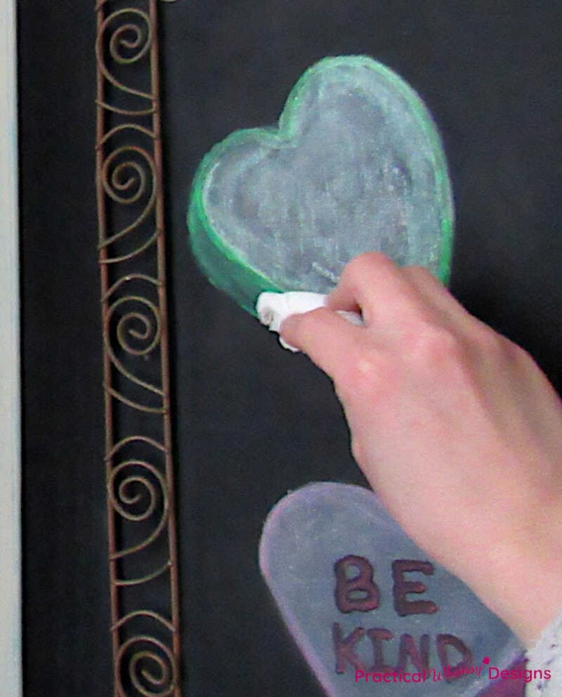 Blending chalk marker with tissue on heart
