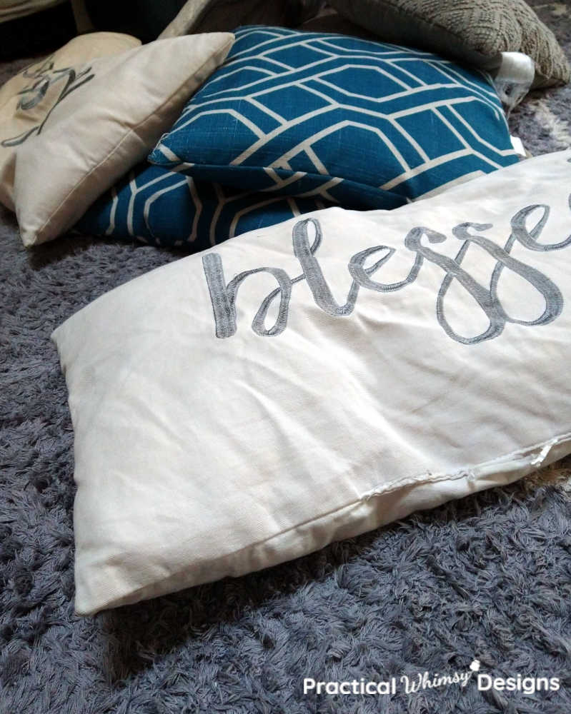 Flat decorative pillows before washing.