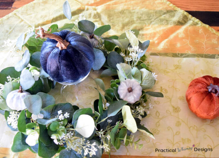 Velvet Pumpkin and wreath centerpiece on dinning room table.