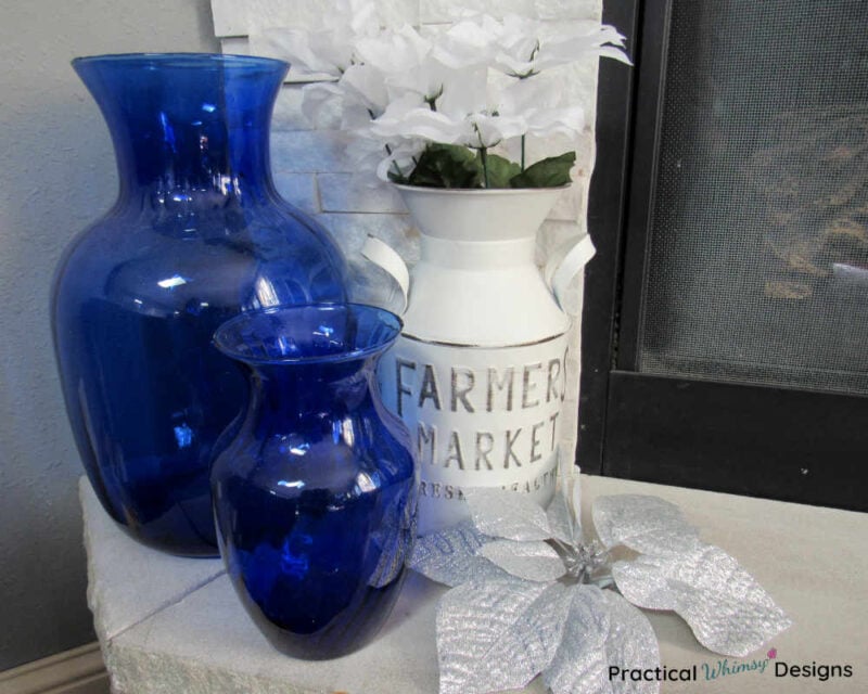 Blue vases and white jug on hearth