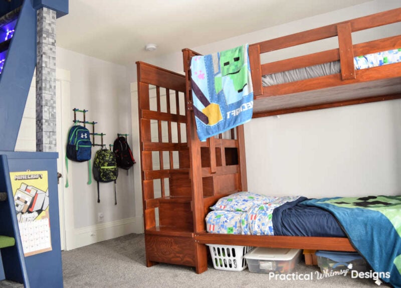 Bunk beds and backpack holder in boys room