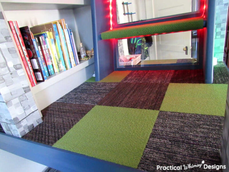 Green and grey checkered carpet on stairs platform