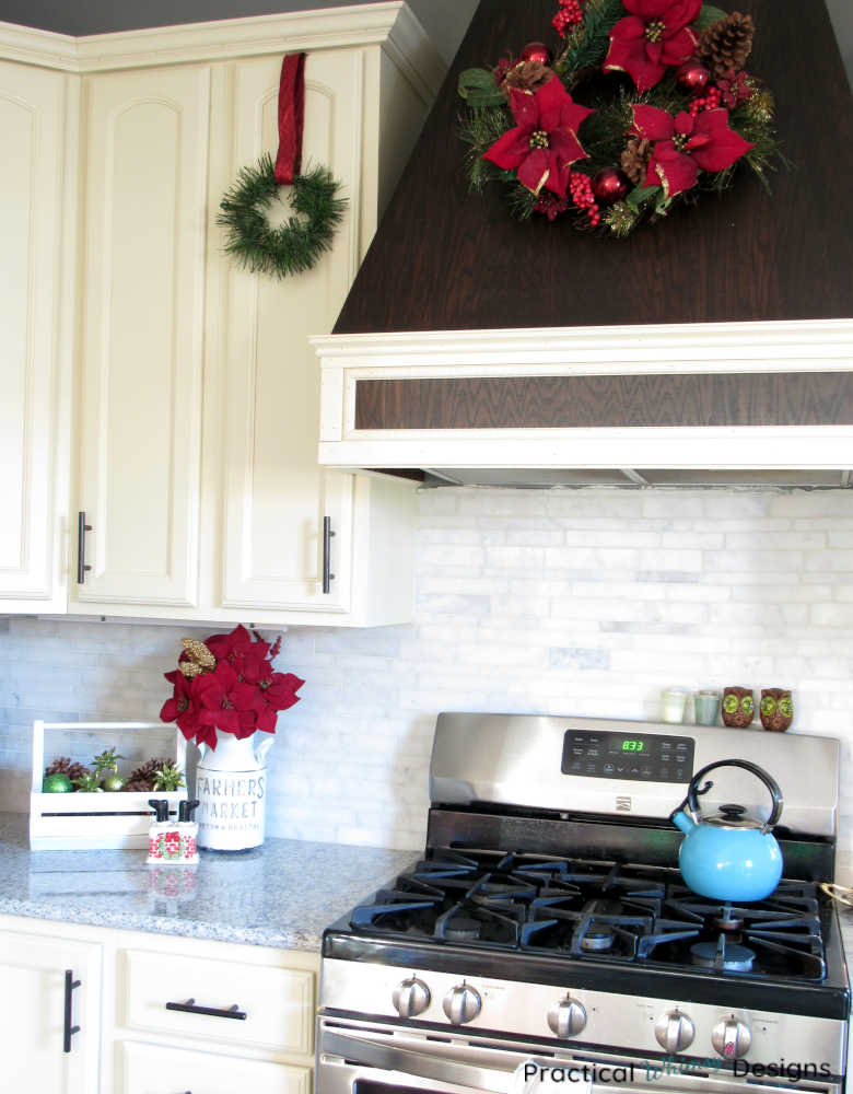 Christmas decorations on counter and kitchen cabinets