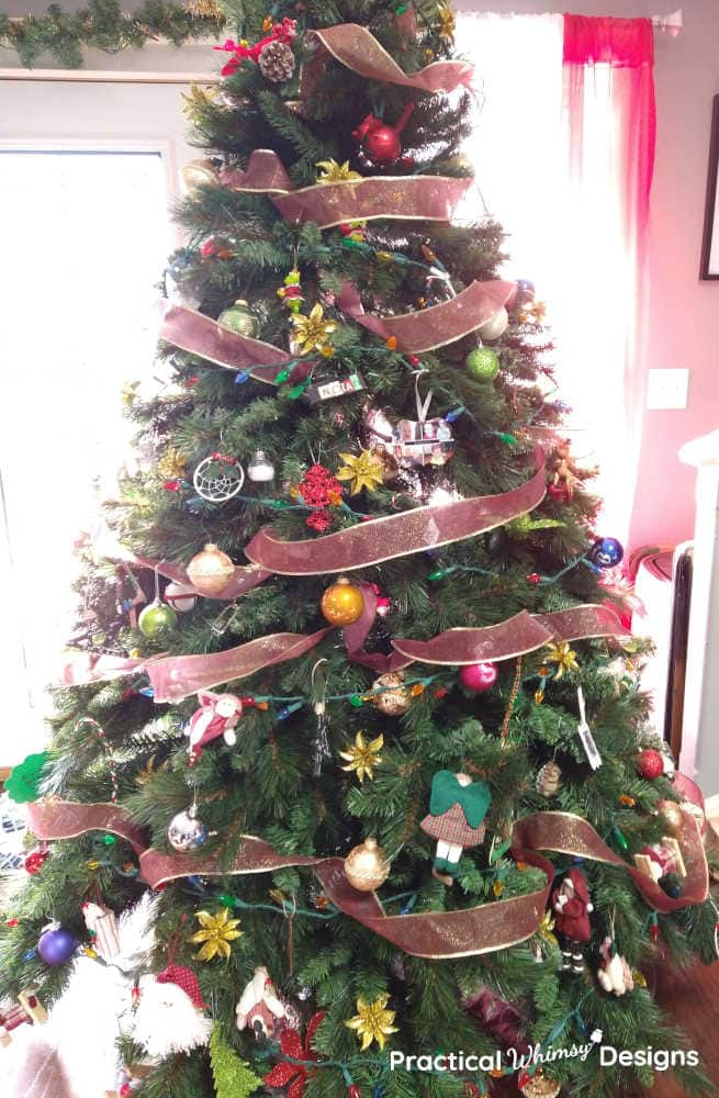 Christmas tree decorated with red ribbon and ornaments