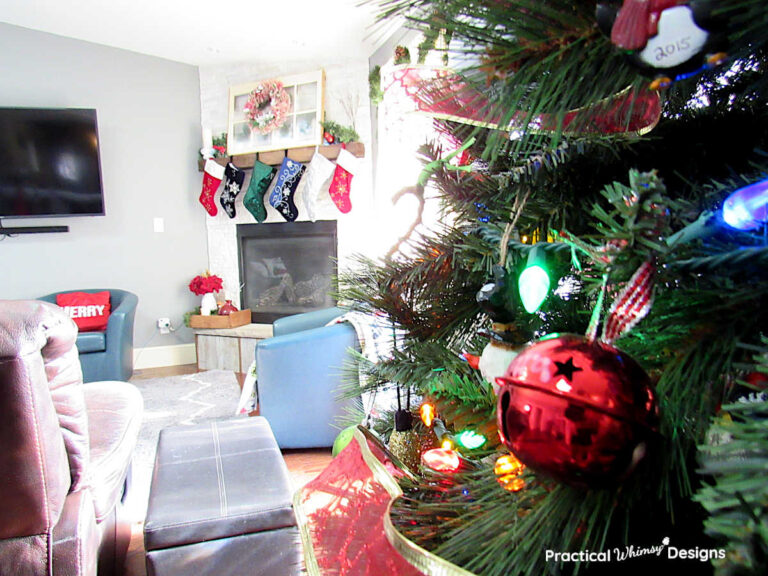 Close up of Christmas tree with mantel in family room