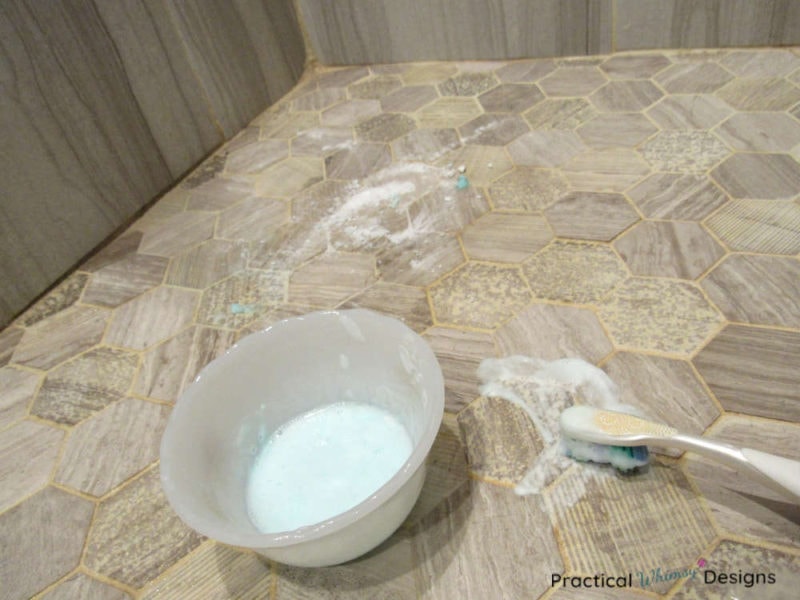 How to clean grout with baking soda, hydrogen peroxide, soap and a toothbrush.
