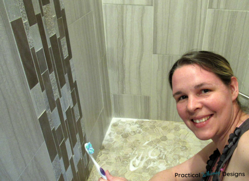 Cleaning grout with a toothbrush