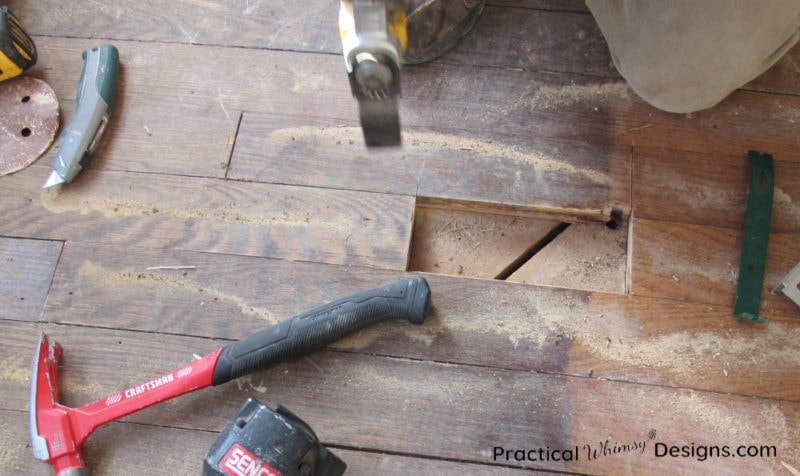 Cutting out damaged hardwood floor