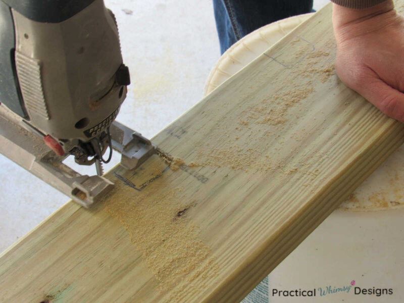 Cutting out notch in rafter with a jigsaw.