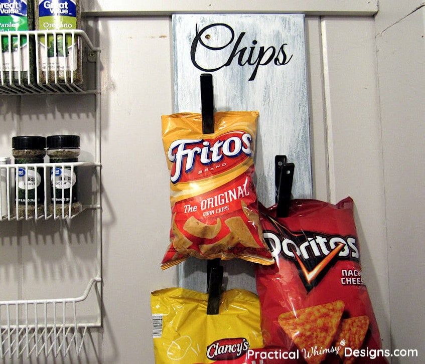 Chips hanging on DIY chip storage rack in pantry