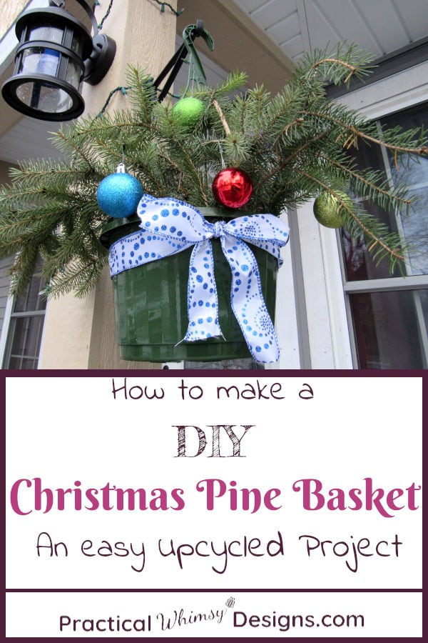 DIY Christmas pine basket hanging outside by light.