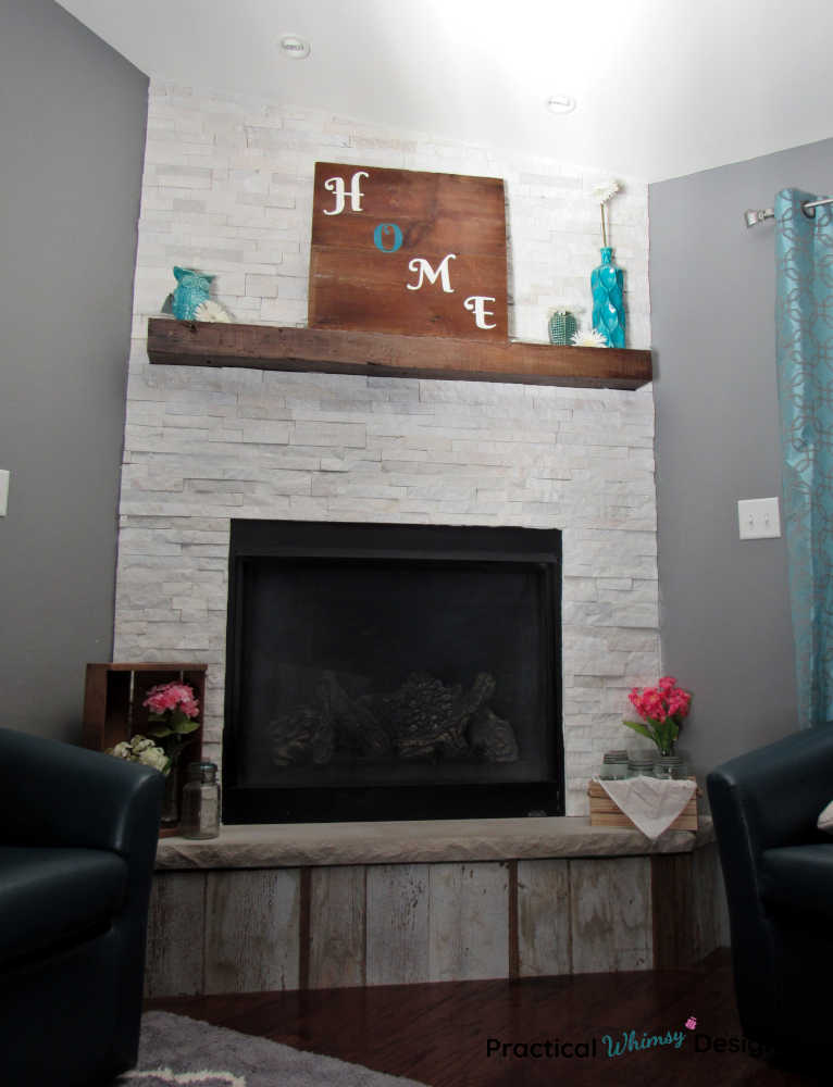 Wooden home sign on mantel in family room