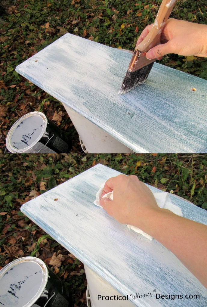 Using paint brush and rag to create a distressed painting technique on chip storage rack
