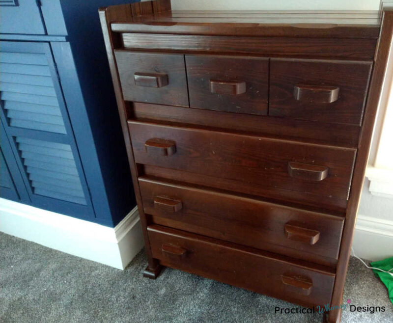 Dark brown wooden dresser with four drawers.