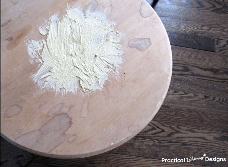 Dried putty on table before sanding.