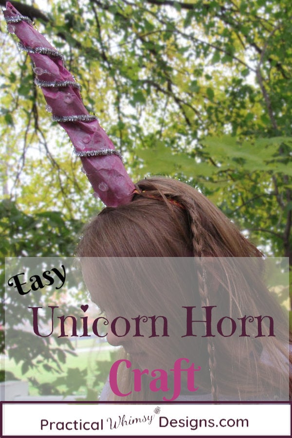 Girl wearing a pink horn made using the easy unicorn horn craft tutorial.