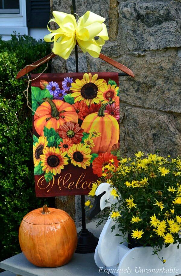 Pumpkins, flag, and flowers