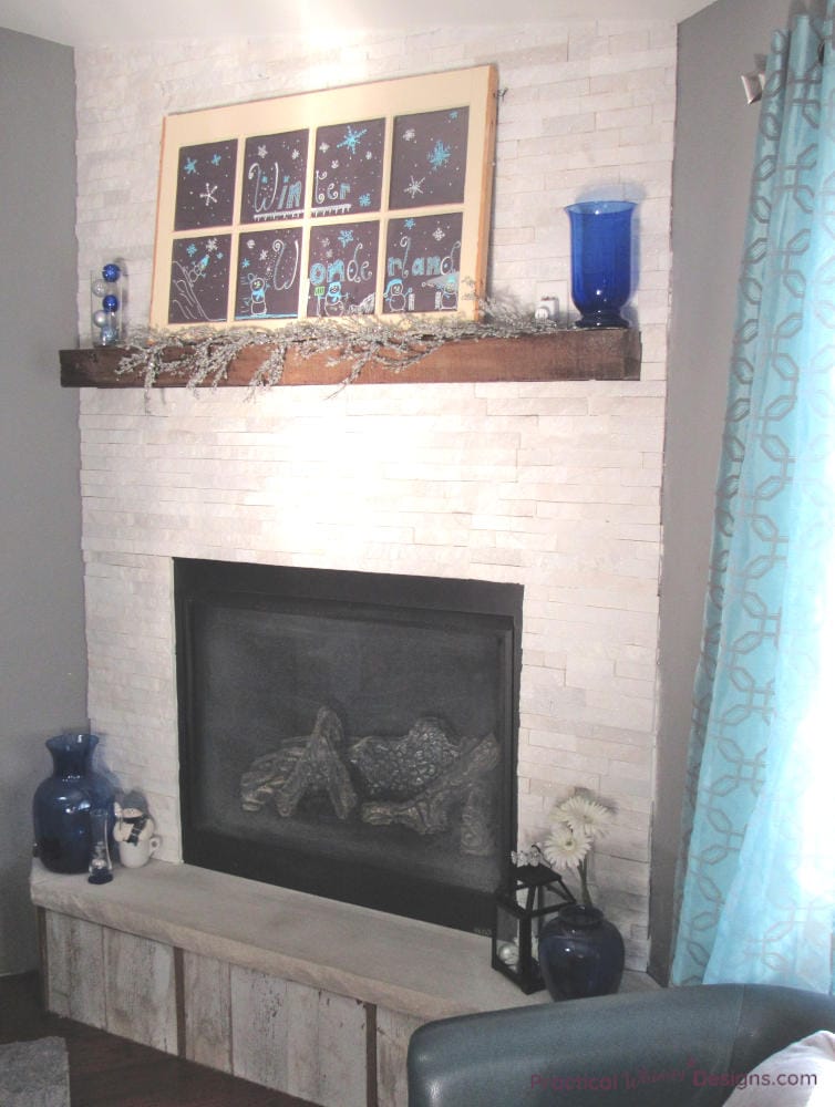 faux chalkboard window above the fireplace