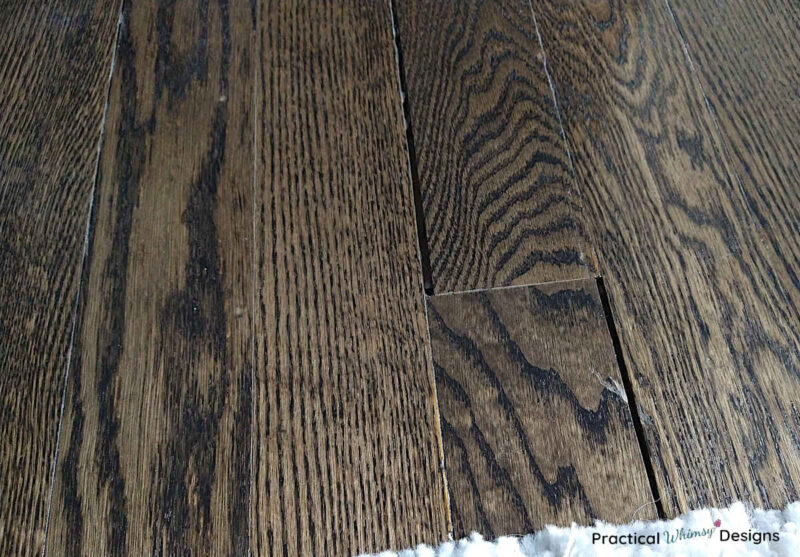 Stained hardwood flooring with gaps between each board