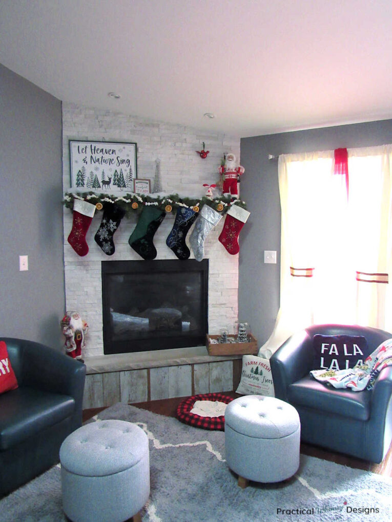 Old fashioned Christmas decorations on fireplace mantel and hearth.