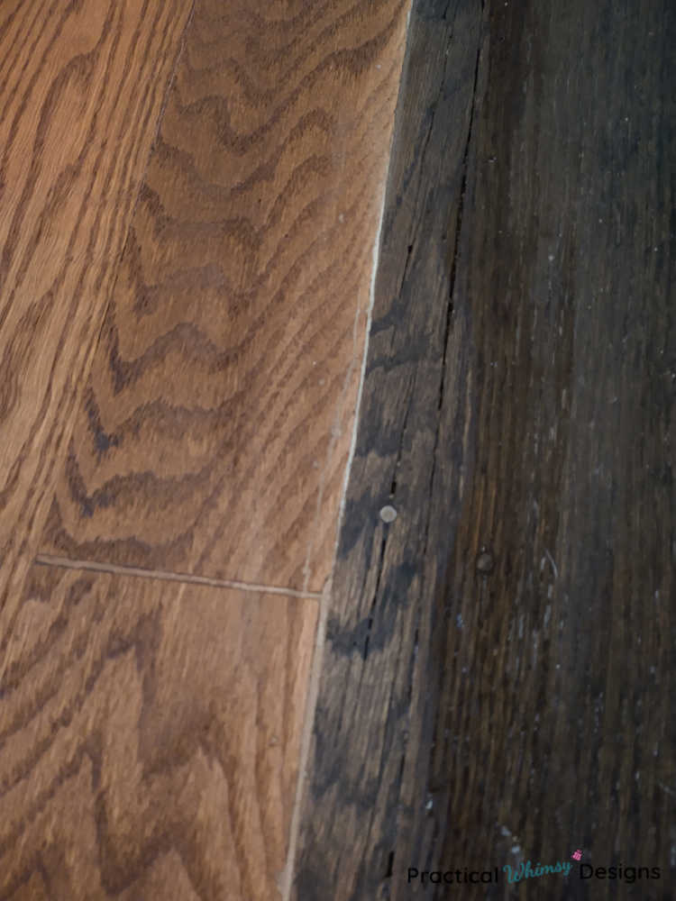 Wood flooring stained two different shades of brown.