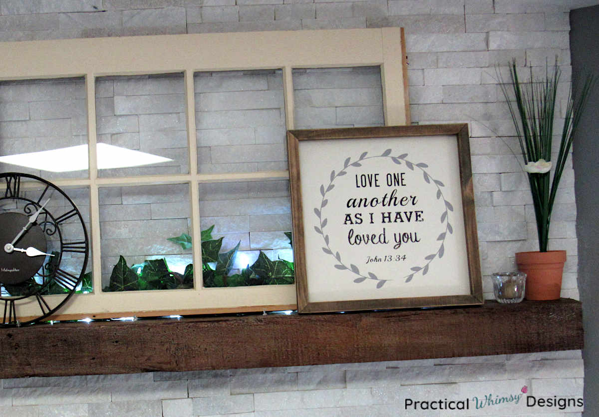 Window on mantel with green, white, and brown spring decor