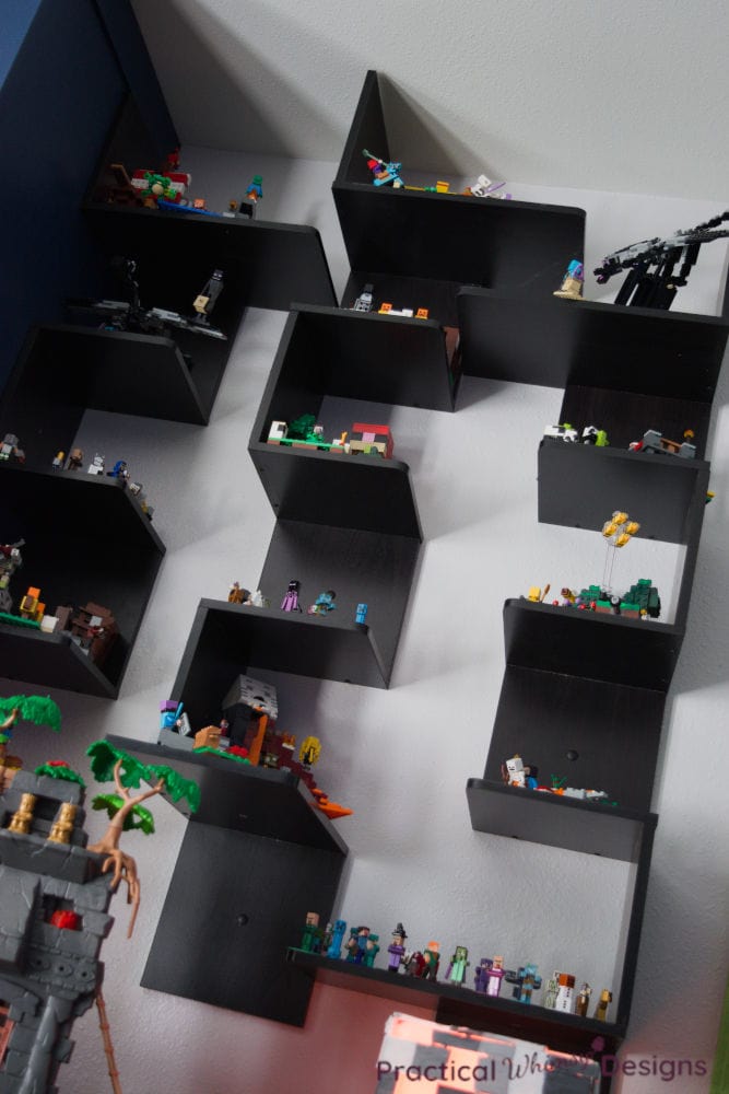 Black shelving with Minecraft Legos display in boys themed video game bedroom