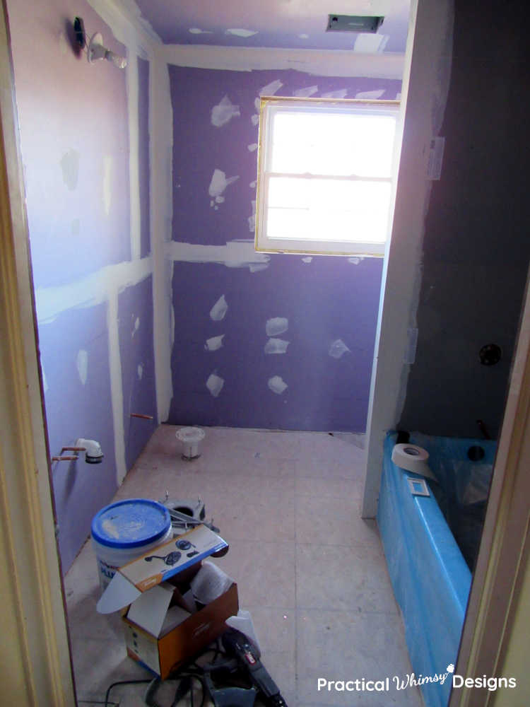 Main 2nd floor bathroom with new drywall and tub installed